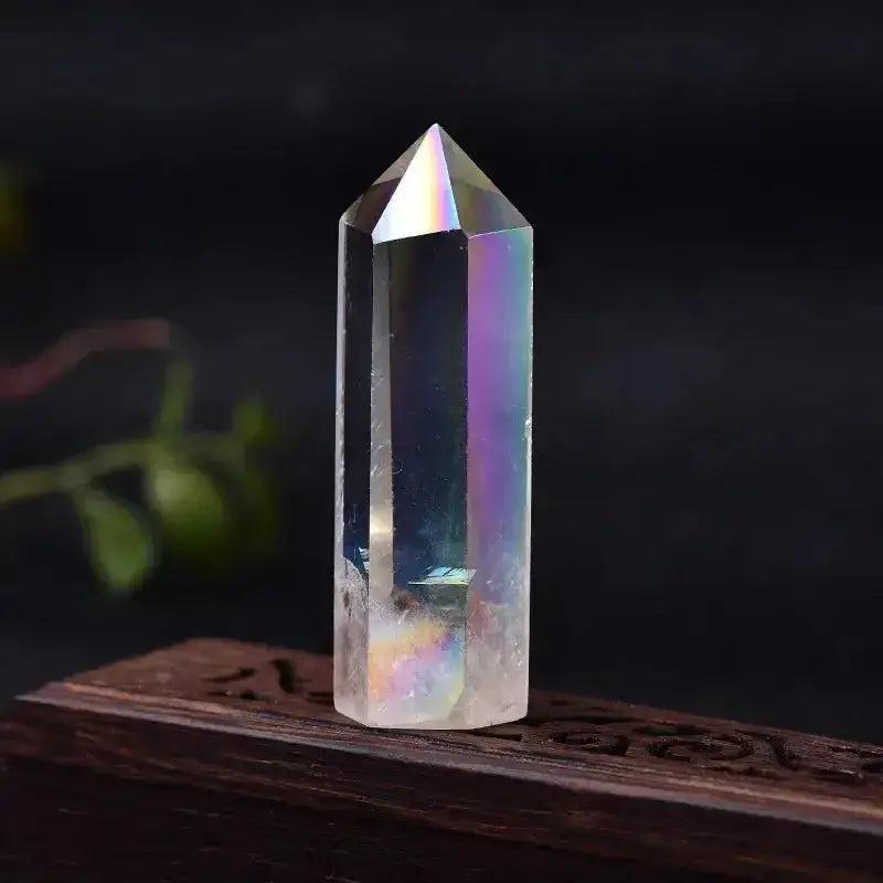 Iridescent clear quartz crystal tower, hand-polished to amplify energy and enhance spiritual practice.