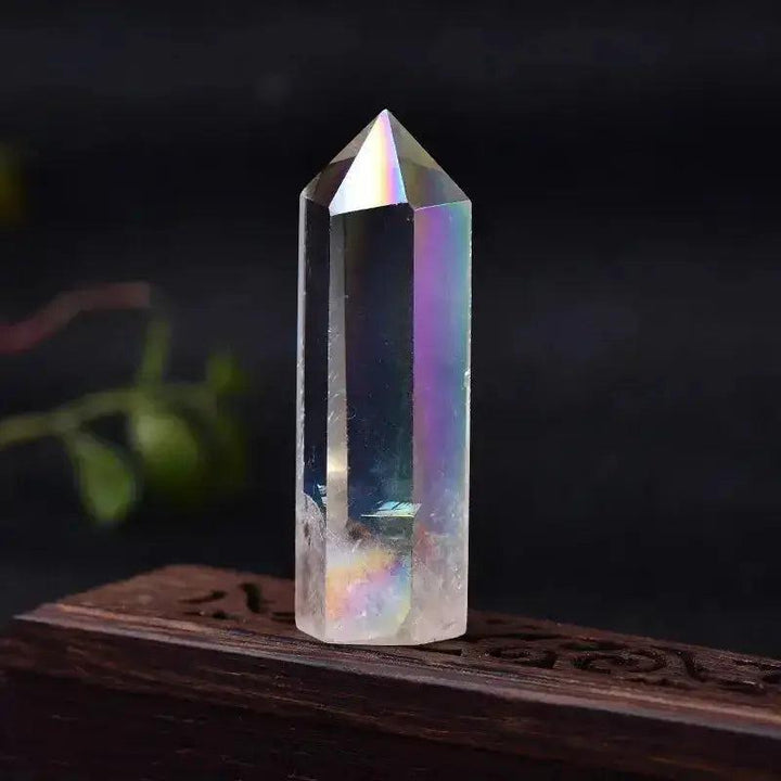 Iridescent clear quartz crystal tower, hand-polished to amplify energy and enhance spiritual practice.