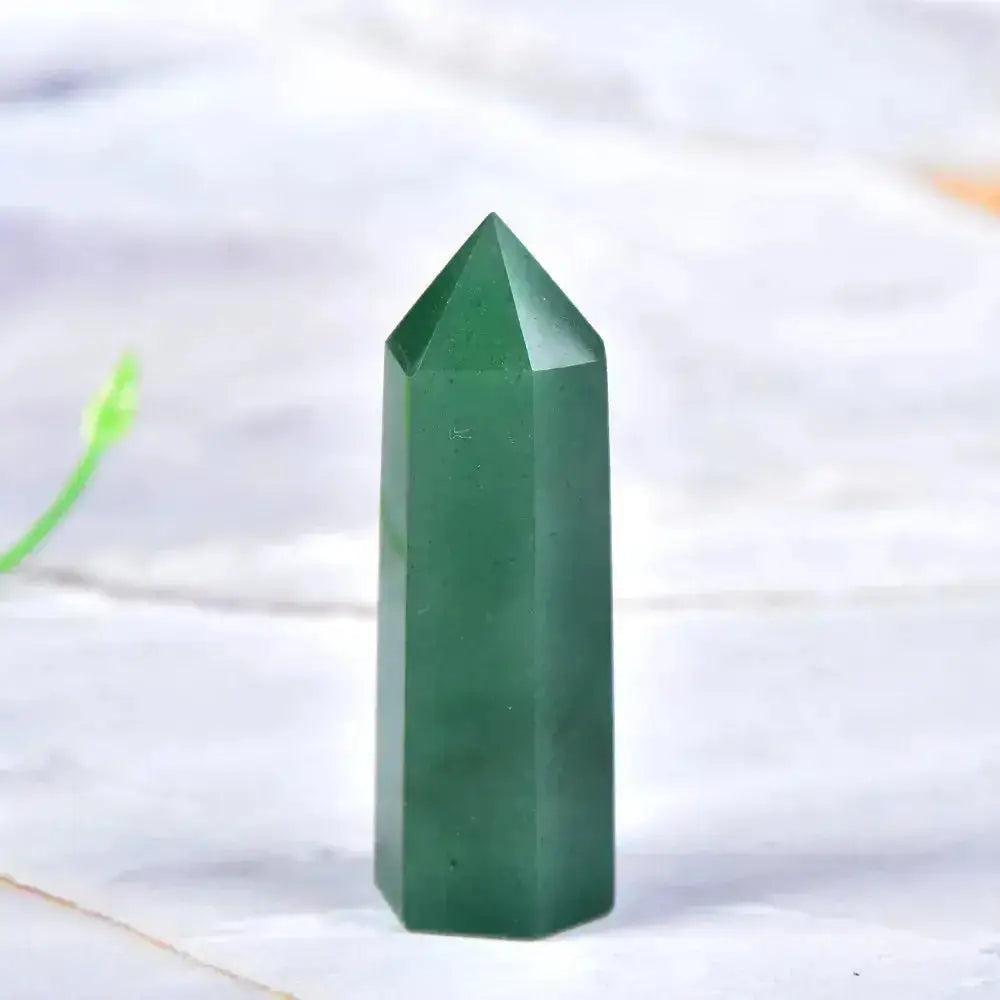 Polished green aventurine crystal tower, a powerful tool for manifestation and chakra balancing.