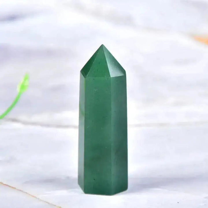 Polished green aventurine crystal tower, a powerful tool for manifestation and chakra balancing.