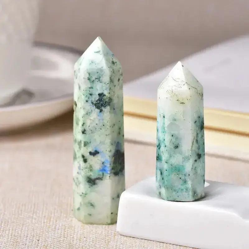 Two polished K2 Jasper crystal towers, one tall and one shorter, with white and blue-green speckles.