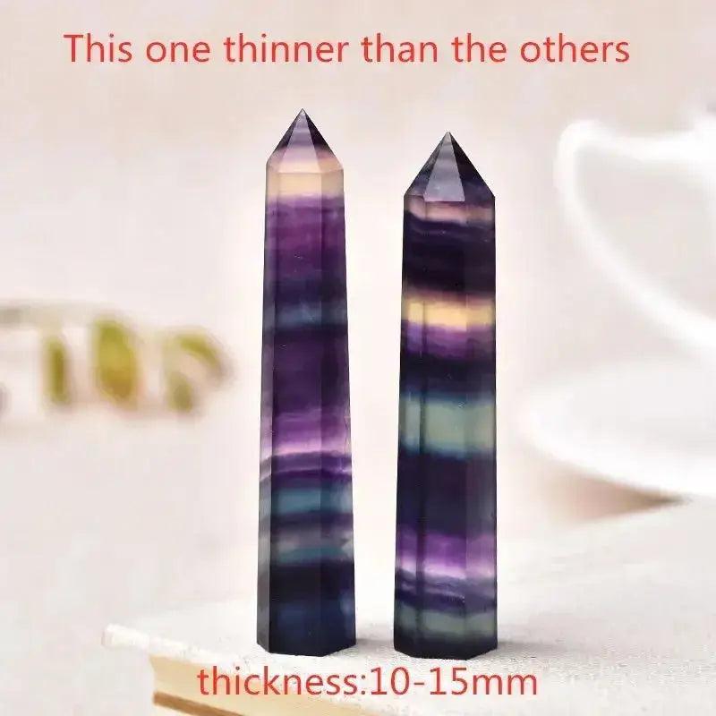 Vibrant fluorite crystal towers, hand-polished with unique purple, green, and yellow bands, perfect for energy work and décor.
