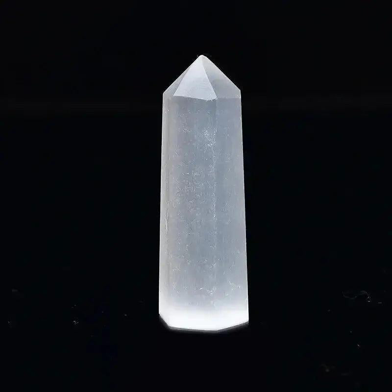 Polished clear quartz crystal tower, a powerful tool for energy amplification and spiritual practice.