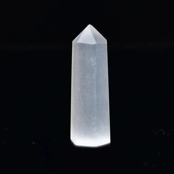 Polished clear quartz crystal tower, a powerful tool for energy amplification and spiritual practice.