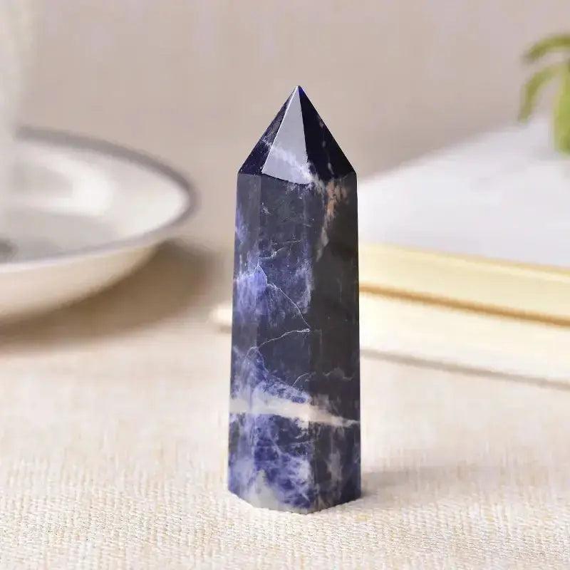 Polished Sodalite Crystal Tower, a dark blue and white natural stone for chakra balancing and spiritual practice.
