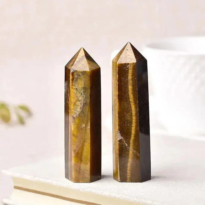 Two polished Tiger's Eye Crystal Towers, showcasing golden-brown hues and unique patterns, ideal for energy work and décor.