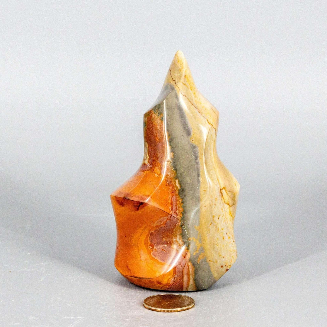 Premium Polychrome Jasper Flame with earthy reds, oranges, browns, and creamy whites in flowing patterns.