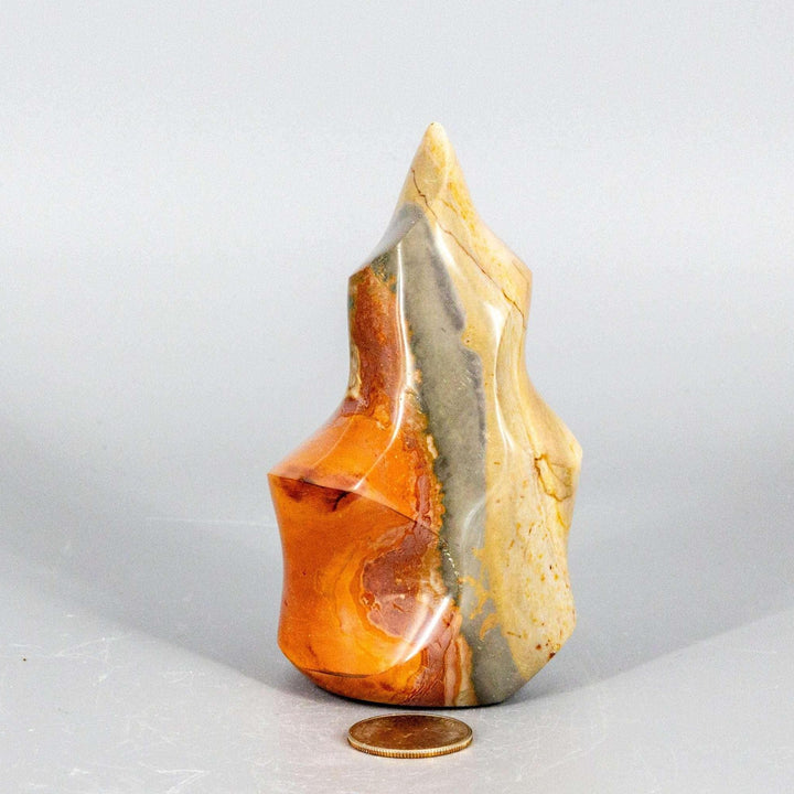 Premium Polychrome Jasper Flame with earthy reds, oranges, browns, and creamy whites in flowing patterns.