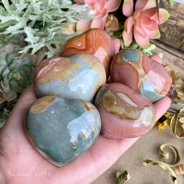 Polychrome Jasper Heart: Hand-carved, polished hearts with earthy rainbow swirls of red, orange, brown, and cream.