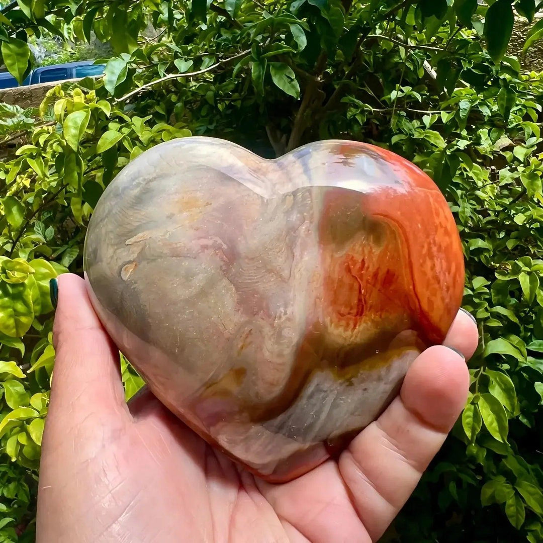 Polychrome Jasper Heart: Vibrant, polished crystal heart with swirling earthy reds, oranges, browns, and creams.