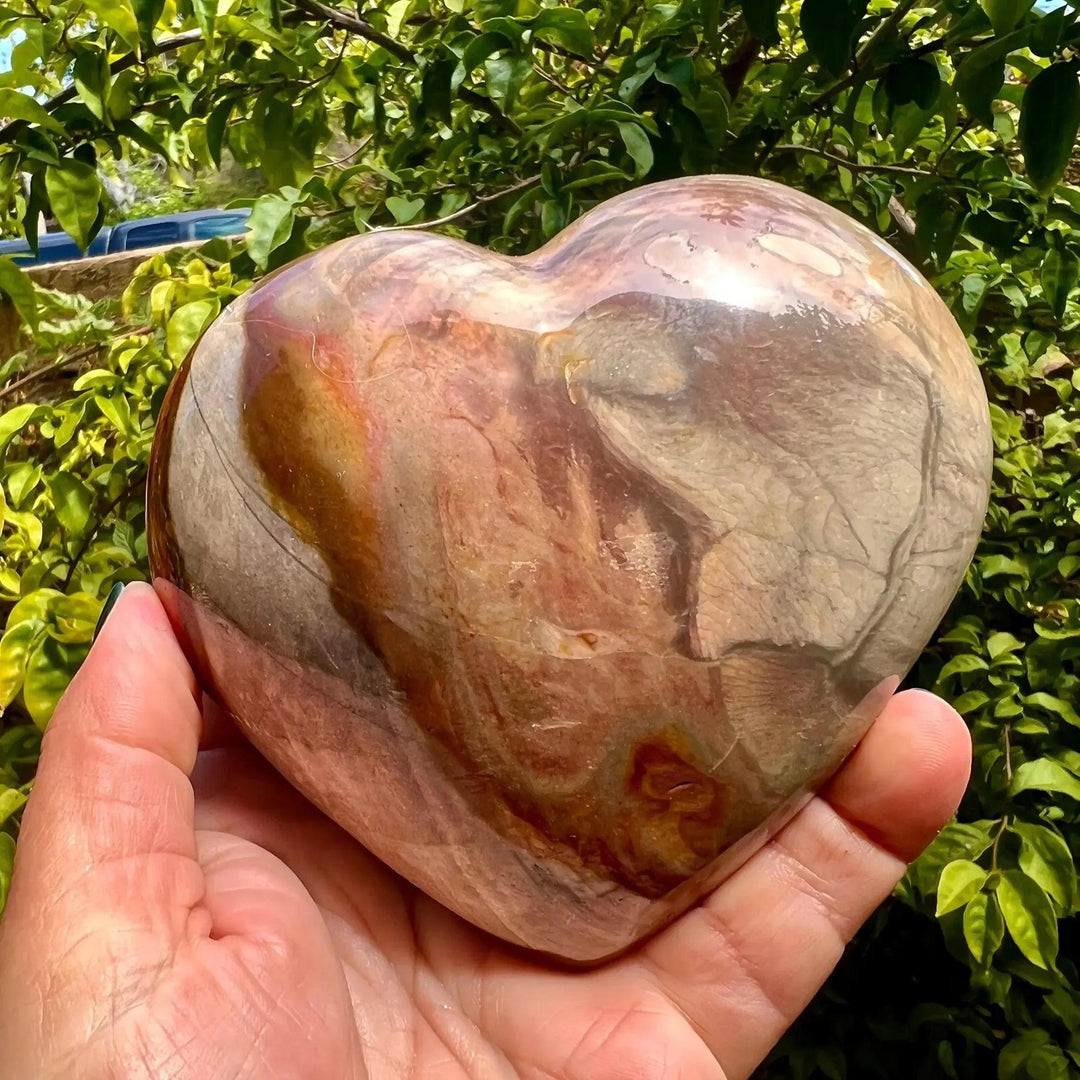 Polychrome Jasper Heart: Hand-carved, polished crystal heart with swirling earthy reds, oranges, browns, and creams.