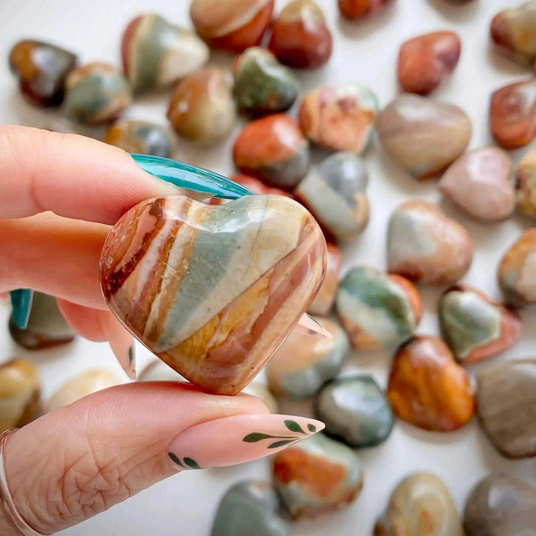 Polychrome Jasper Heart: Hand-carved, polished crystal heart with swirling earthy reds, oranges, browns, and creams.