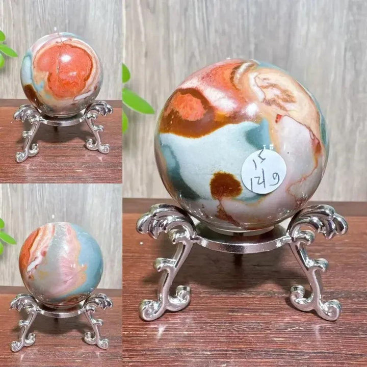Polychrome Jasper Crystal Sphere: Vibrant earthy reds, browns, tans, and grays swirl on a polished sphere for grounding energy.