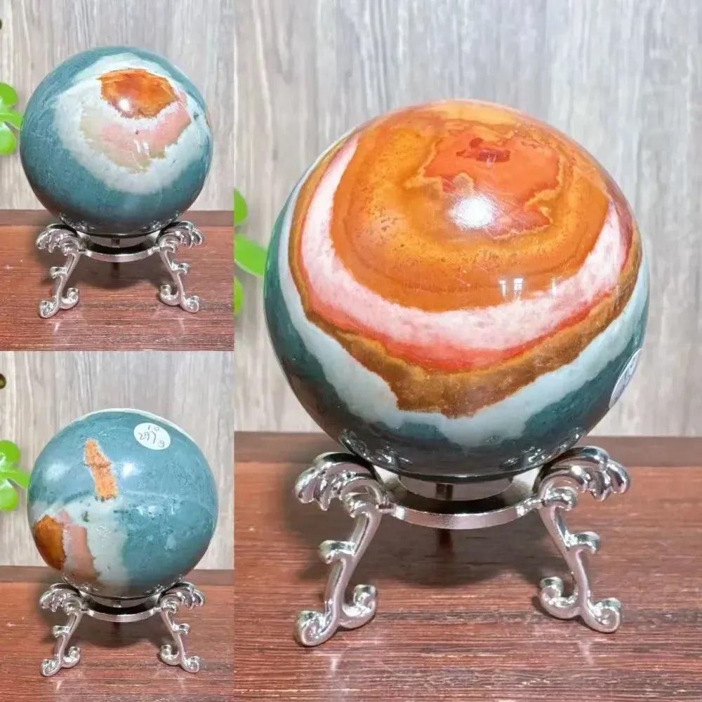 Polychrome Jasper Crystal Sphere: Hand-polished sphere with earthy reds, browns, tans, and grays on a silver stand.