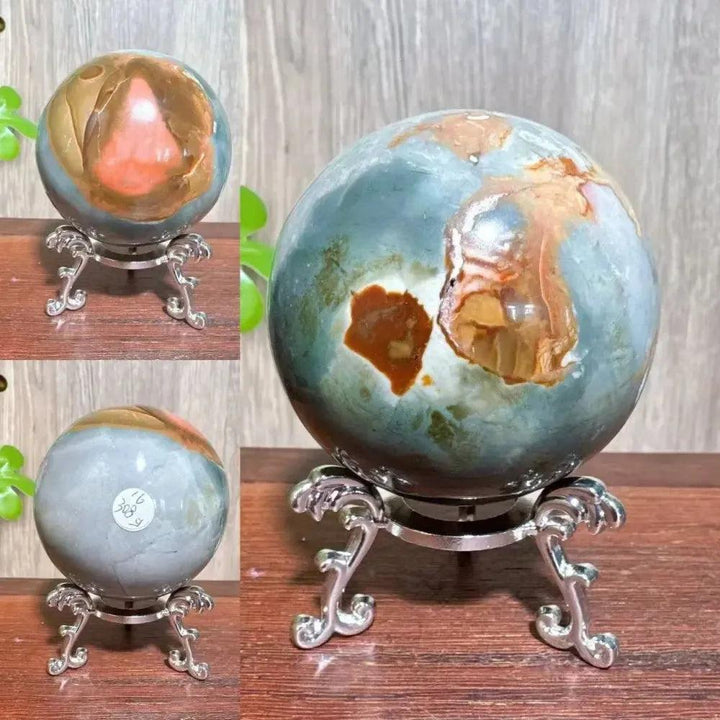 Polychrome Jasper Crystal Sphere: Vibrant earthy reds, browns, tans, and grays swirl on a polished crystal sphere on a silver stand.