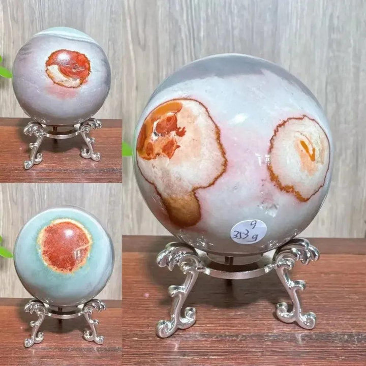 Polychrome Jasper Crystal Sphere: Vibrant earthy reds, browns, tans, and grays swirl in a polished, grounding crystal sphere.