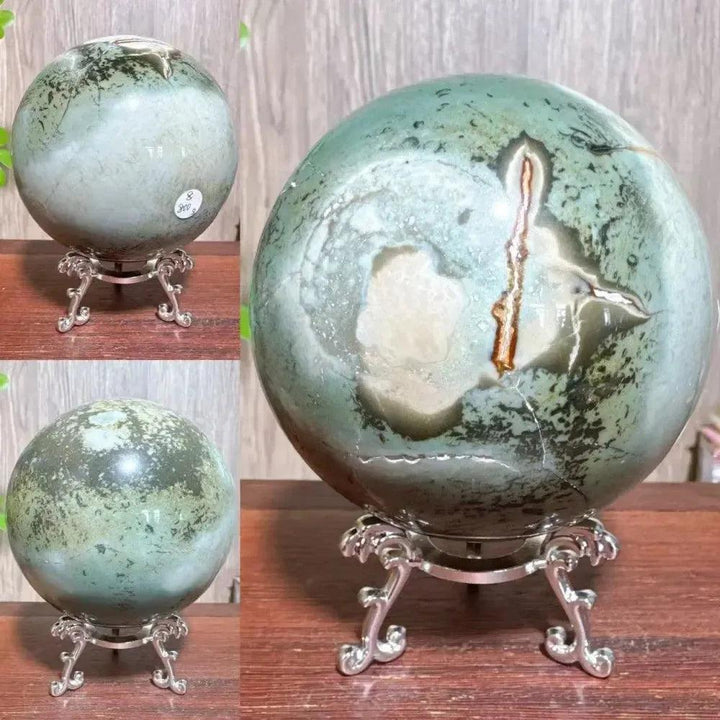 Polychrome Jasper Crystal Sphere: Mesmerizing green, brown, and cream sphere on a silver stand, radiating grounding energy.