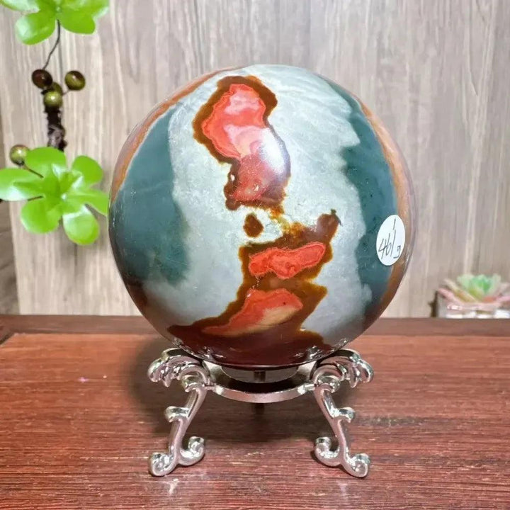 Polychrome Jasper Crystal Sphere: Hand-polished sphere with earthy reds, browns, tans, and grays on a silver stand.