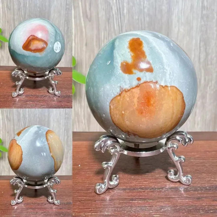 Polychrome Jasper crystal sphere by Crystal Destiny, featuring earthy reds, browns, tans, and grays on a silver stand.
