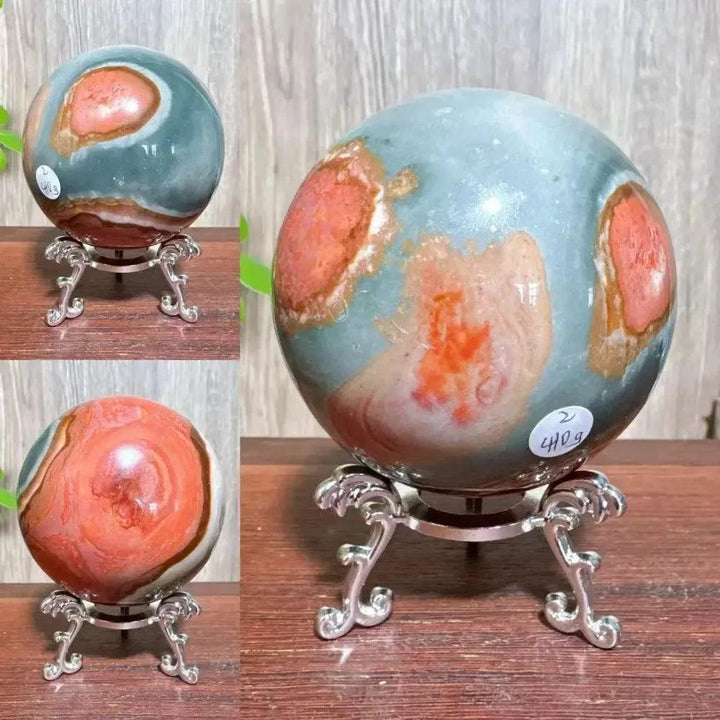 Polychrome Jasper crystal sphere from Crystal Destiny, featuring earthy reds, browns, tans, and grays on a silver stand.