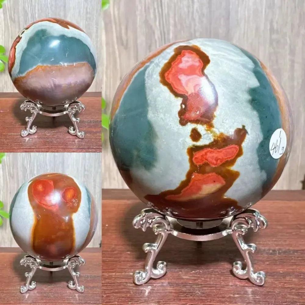 Polychrome Jasper crystal sphere from Crystal Destiny, featuring earthy reds, browns, tans, and grays on a silver stand.