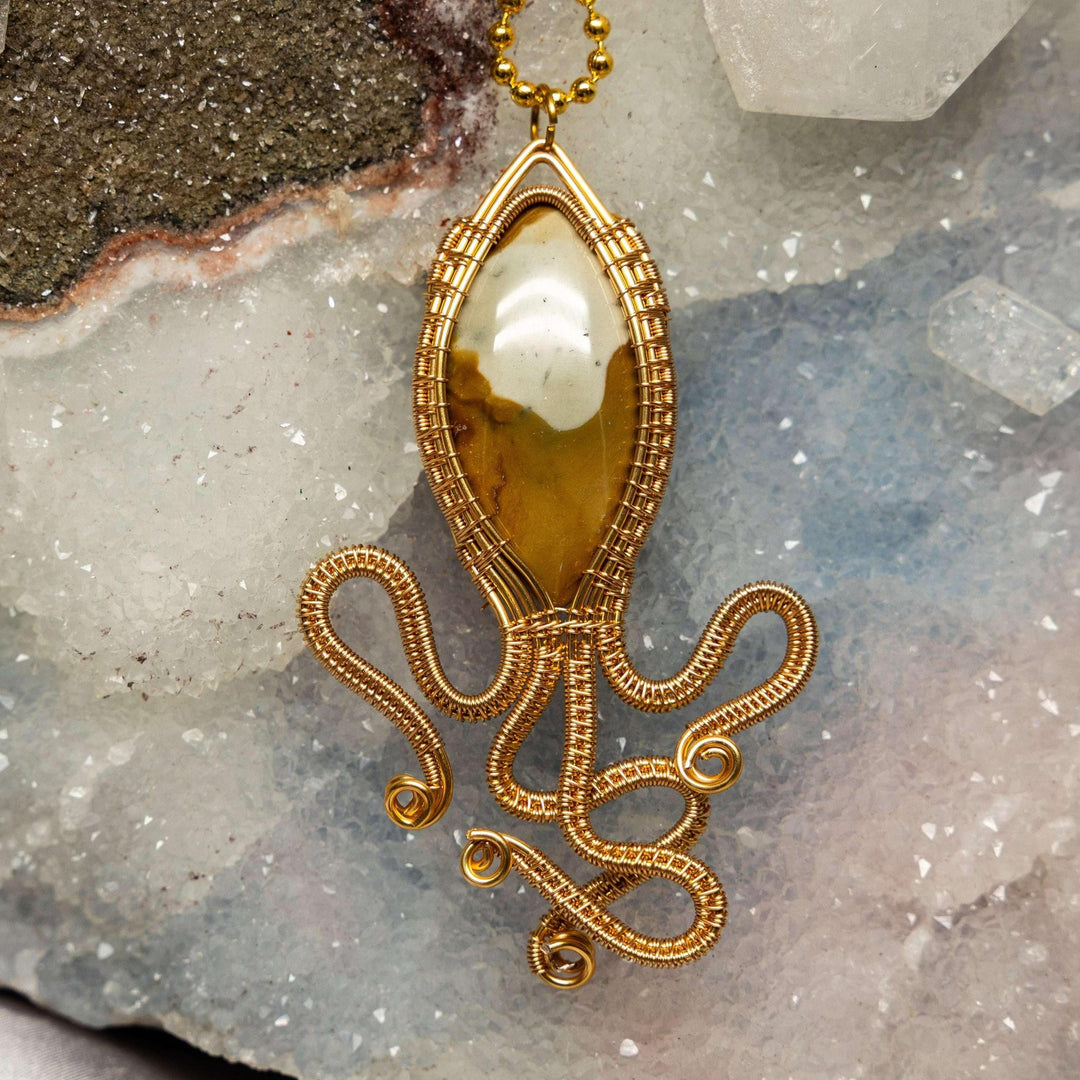 Polychrome Jasper Squid Wire Wrap Pendant: Handcrafted copper squid pendant with an earthy, vibrant Polychrome Jasper.