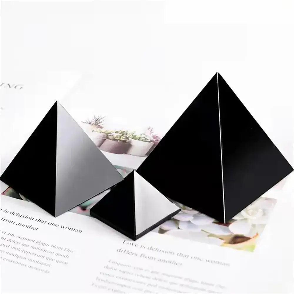 Three dark, serious pyramid crystals for grounding and stability: Obsidian, Shungite, and Black Tourmaline.