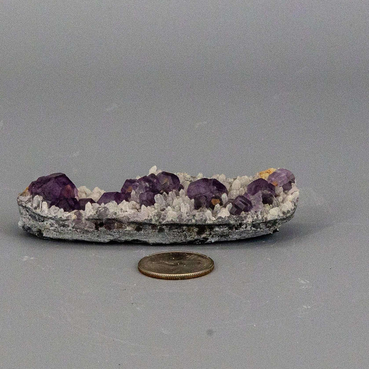 Purple Fluorite Cubes on Calcite "Nubbies" specimen with deep purple cubes and creamy, rounded calcite.