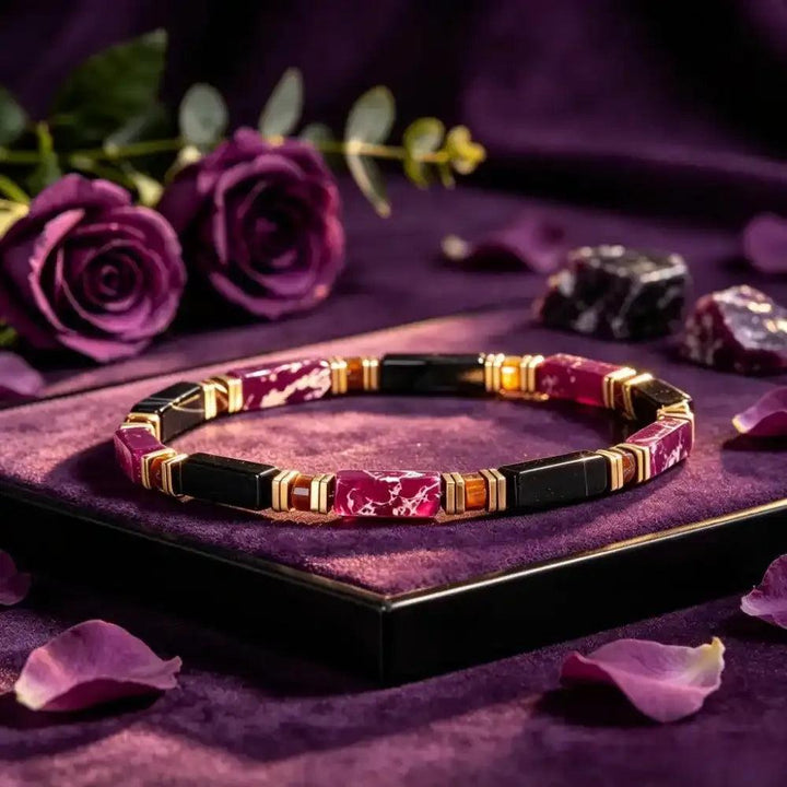 Purple Imperial Jasper and Black Onyx bracelet with gold-tone spacers, grounding tiger's eye accents, and geometric beads.