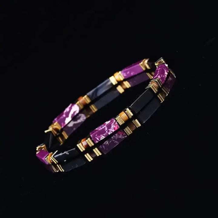 Purple Imperial Jasper and black onyx bracelet featuring rectangular beads, tiger's eye accents, and elegant gold-tone spacers.