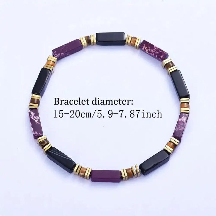 Purple Imperial Jasper and black onyx bracelet with tiger's eye accents and gold-tone spacers for grounding style.
