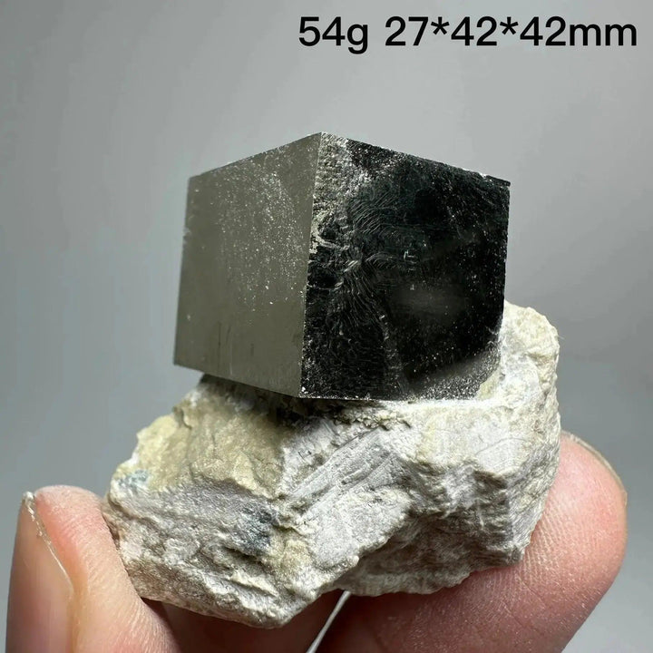 Pyrite Cube Crystal Specimen from Crystal Destiny, featuring a metallic gold luster and sharp cubic formation on a natural matrix.