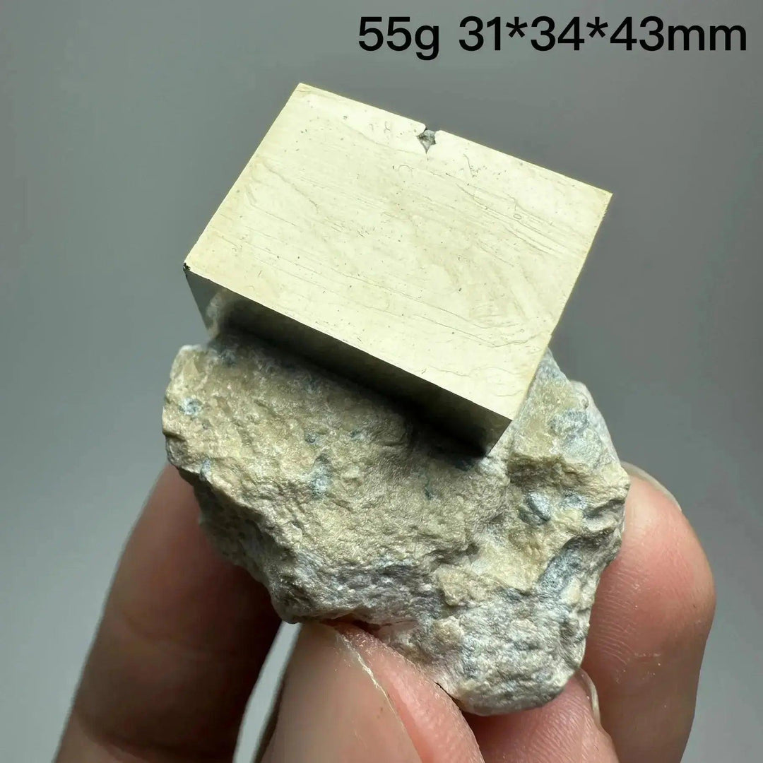 Metallic gold Pyrite Cube Crystal Specimen on a natural rock base, showcasing geometric perfection from Crystal Destiny.