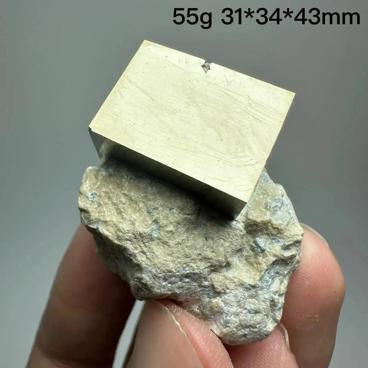 Metallic gold Pyrite Cube Crystal Specimen on a natural rock base, showcasing geometric perfection from Crystal Destiny.