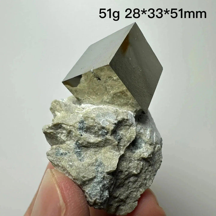 Metallic gold Pyrite Cube Crystal Specimen on a natural rock base, showcasing its geometric perfection from Crystal Destiny.