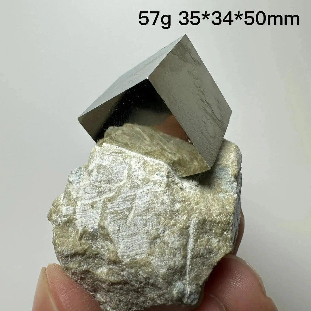 Metallic gold Pyrite Cube Crystal Specimen on a natural rock base, showcasing geometric perfection from Crystal Destiny.