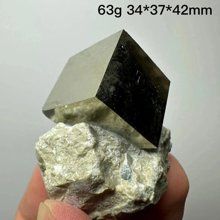 Metallic gold Pyrite Cube Crystal Specimen on a light matrix, showcasing natural geometric perfection from Crystal Destiny.