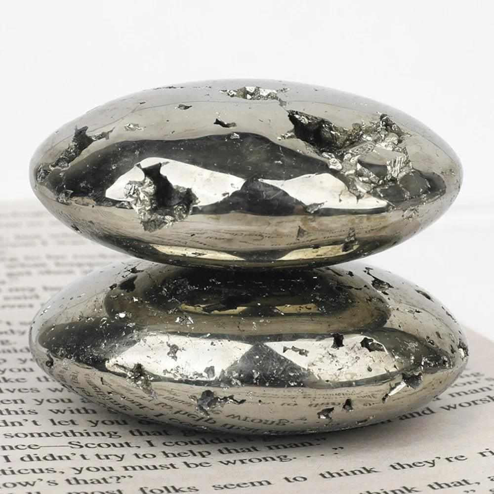 Polished golden Pyrite palm stone with a metallic luster, perfect as a grounding worry stone for confidence and abundance.