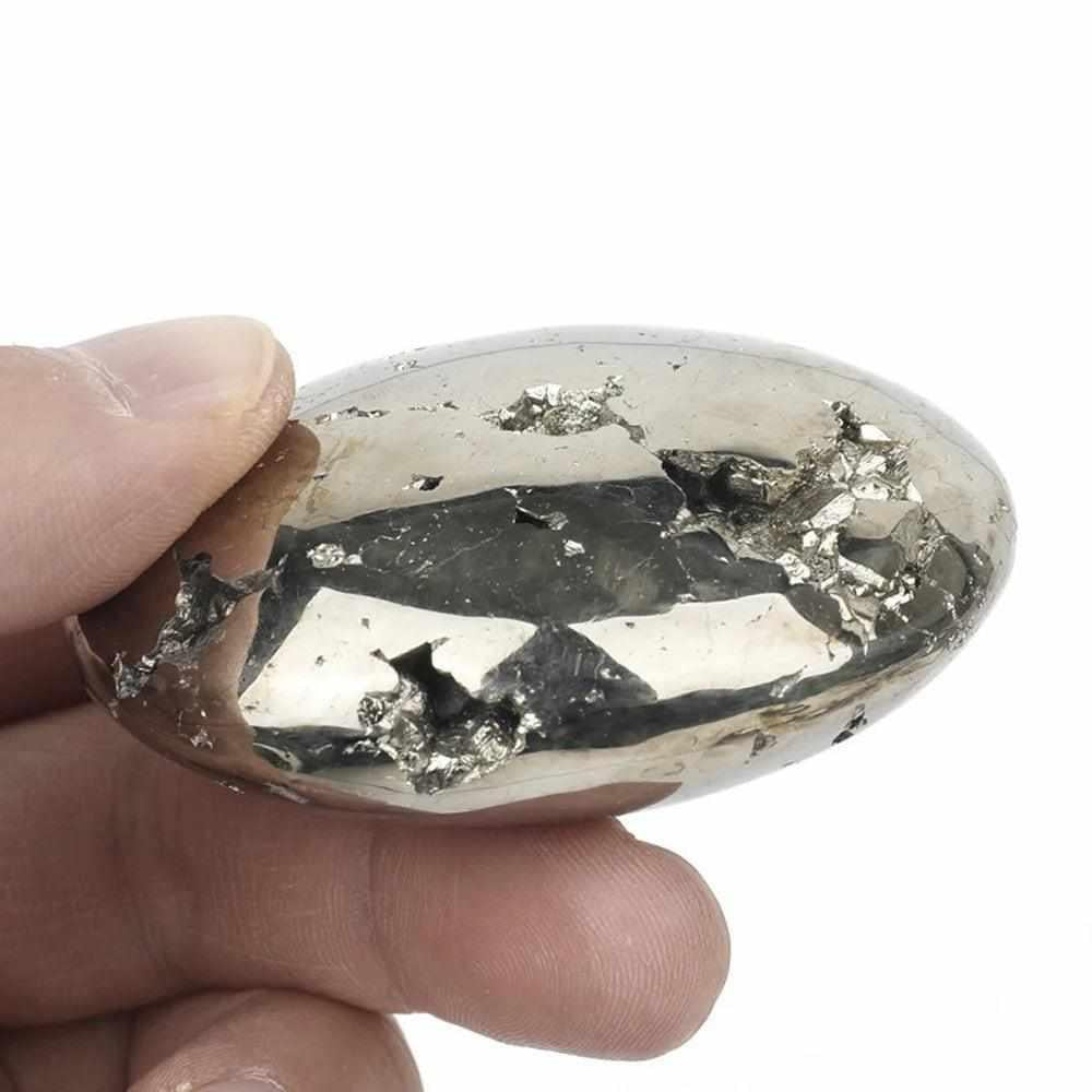 Polished golden Pyrite palm stone with natural metallic texture, perfect as a grounding worry stone for confidence.