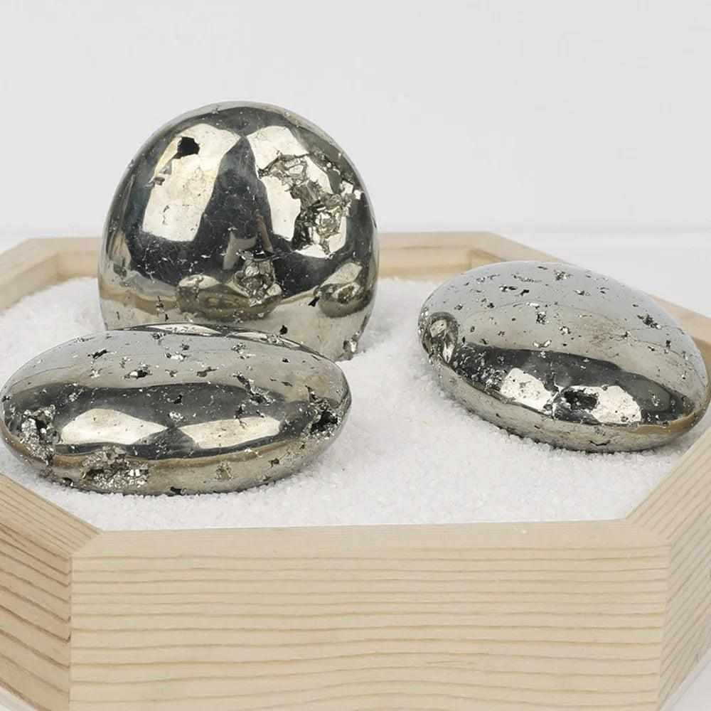 Polished golden Pyrite palm stones with a metallic luster, perfect for confidence and Solar Plexus Chakra healing.