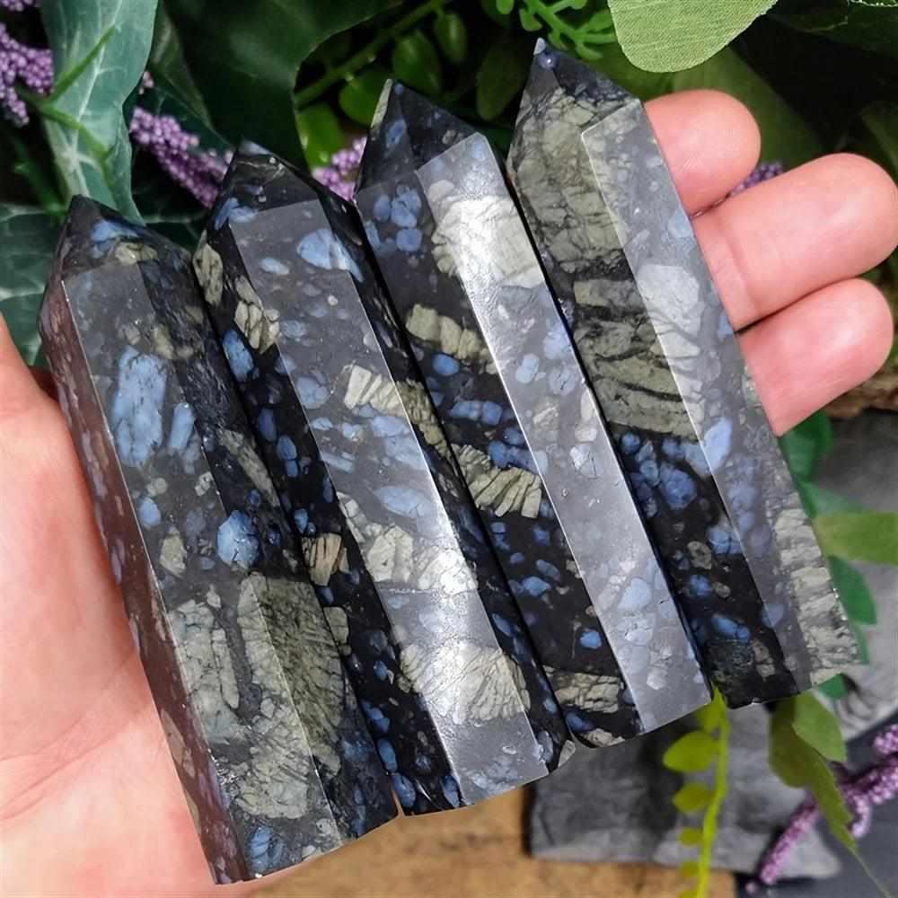 Polished Que Sera stone towers featuring speckled blue, brown, and gray patterns for uplifting, all-chakra energy.
