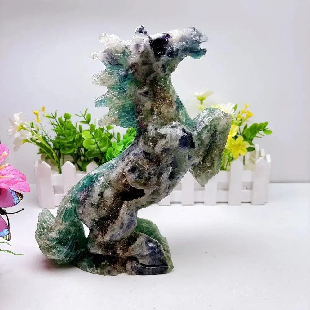 Hand-carved 2.24kg rainbow fluorite horse sculpture featuring vibrant green and purple banding for chakra healing.
