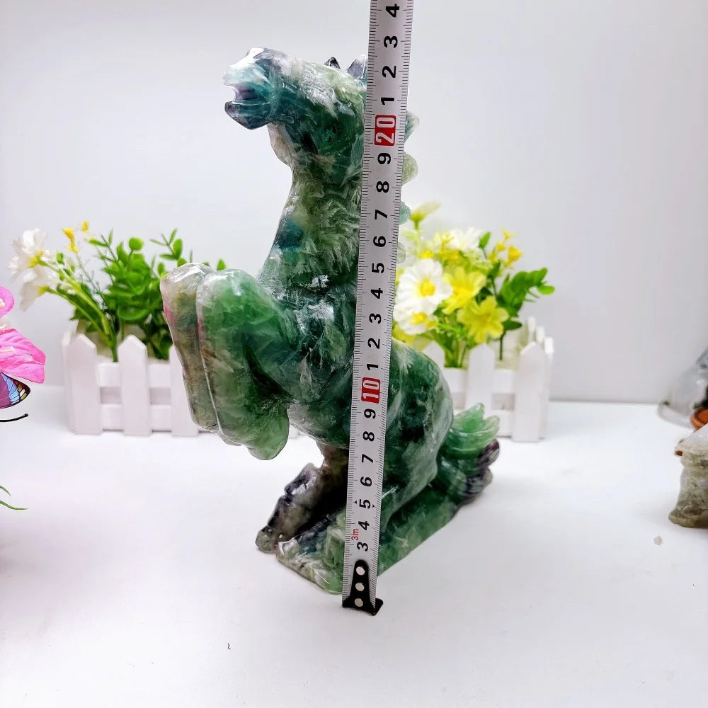 Hand-carved 2.24kg rainbow fluorite horse sculpture featuring vibrant green and purple banding for chakra healing.
