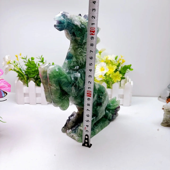 Hand-carved 2.24kg rainbow fluorite horse sculpture featuring vibrant green and purple banding for chakra healing.