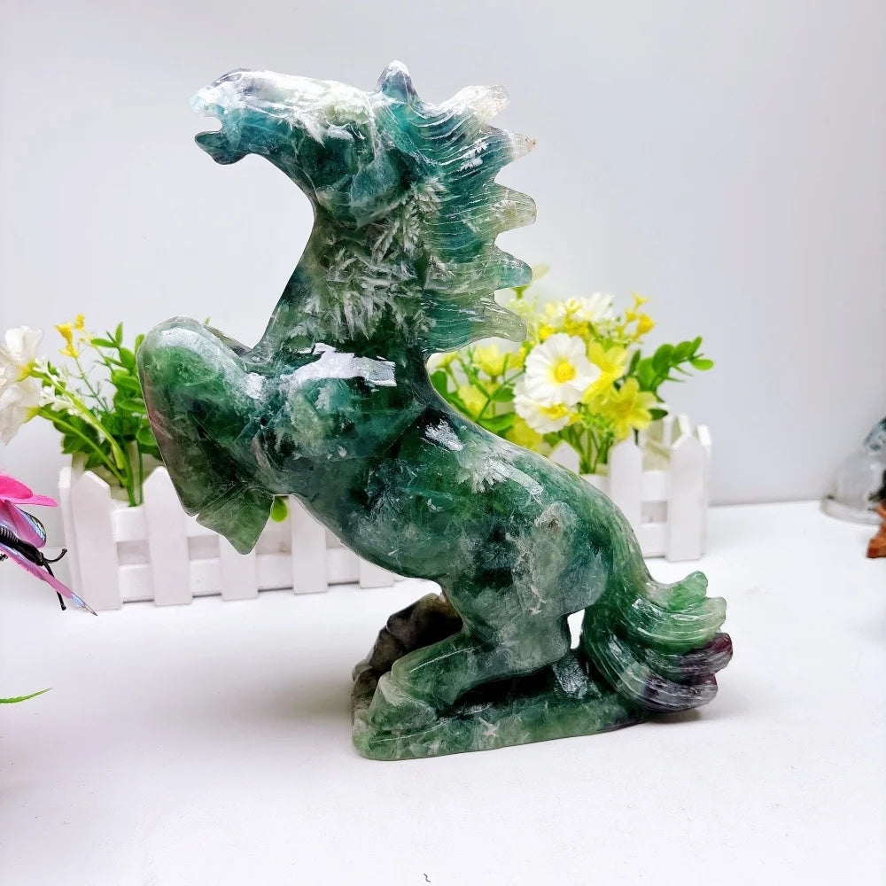 Hand-carved 2.24kg rainbow fluorite horse sculpture featuring vibrant green and purple banding for chakra healing.
