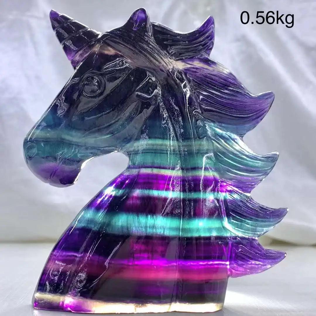 Vibrant rainbow fluorite unicorn carving, 12CM, showcasing stunning purple and teal bands for aesthetic decor.