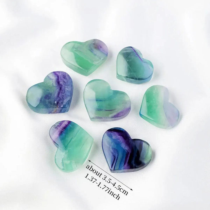 Rainbow Fluorite crystal hearts by Crystal Destiny, featuring polished purple, green, and blue hues.