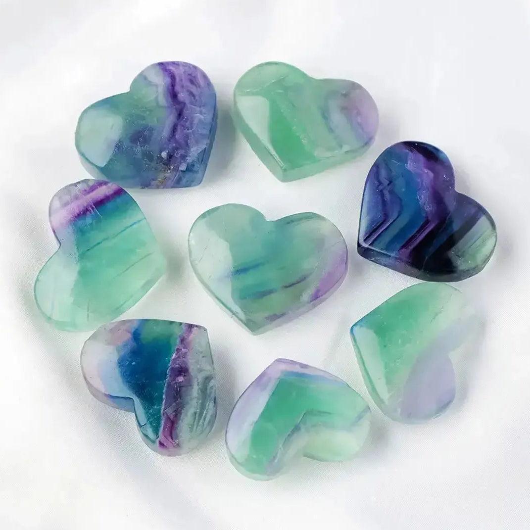 Rainbow Fluorite crystal hearts by Crystal Destiny, featuring purple, green, blue, and clear bands.
