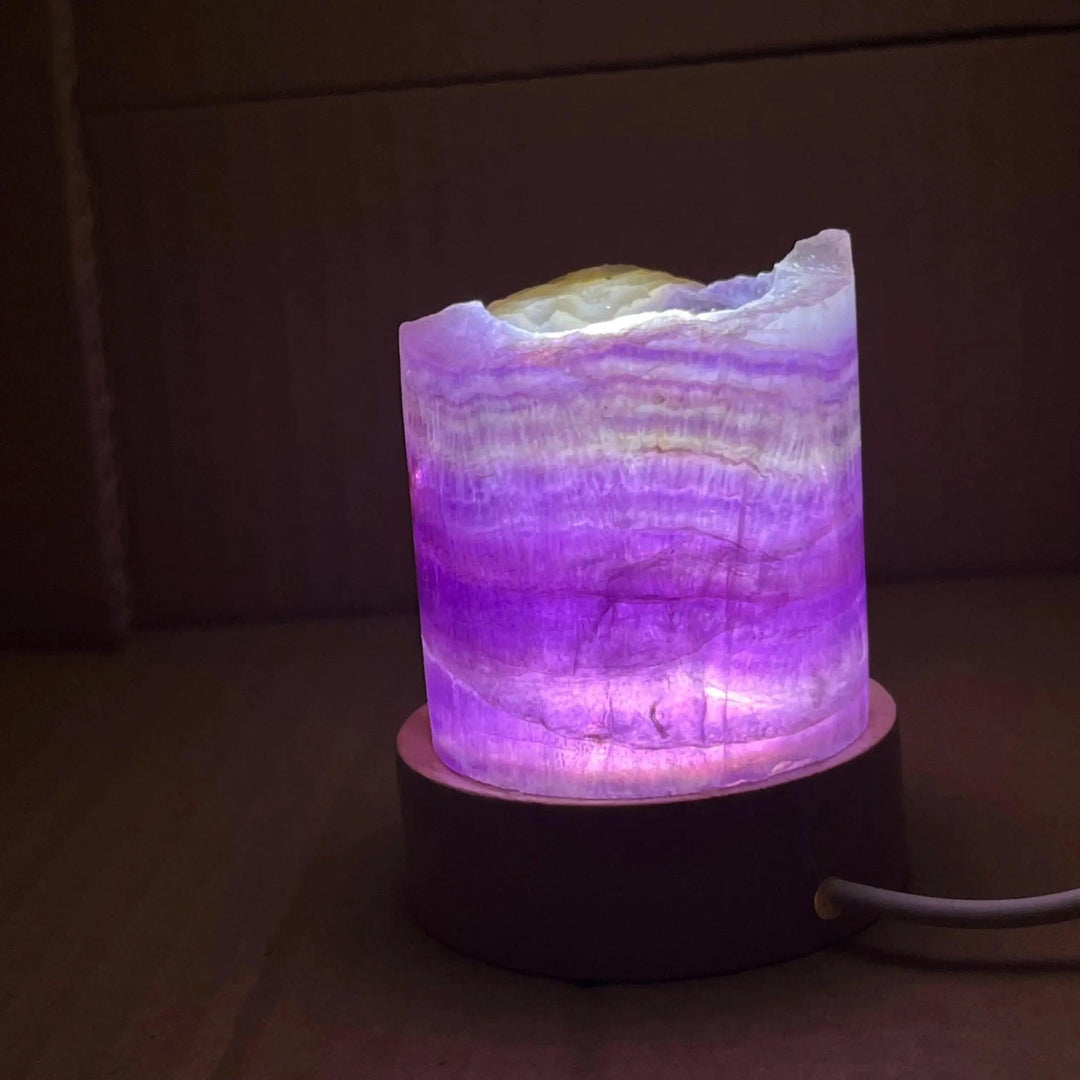 Rainbow Fluorite Crystal Light Lamp with mesmerizing purple, green, and clear bands, illuminated for mental clarity.