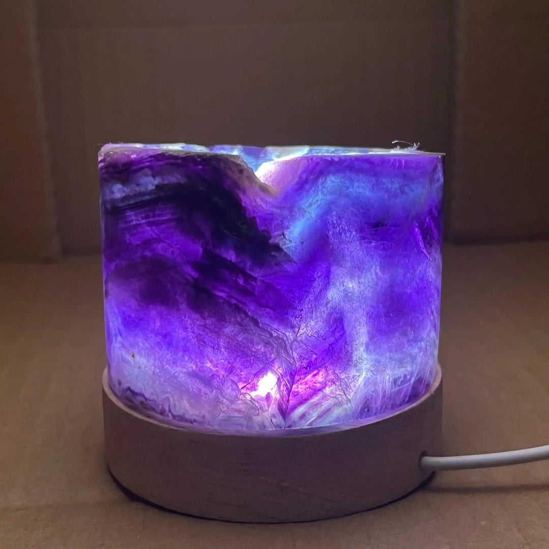Rainbow Fluorite Crystal Light Lamp with mesmerizing purple, blue, and clear bands, illuminated for clarity and balance.